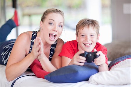 pony tail - Woman and boy playing computer games Stock Photo - Premium Royalty-Free, Code: 614-06973569