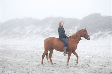 reins - Woman riding horse on beach Stock Photo - Premium Royalty-Free, Code: 614-06973733