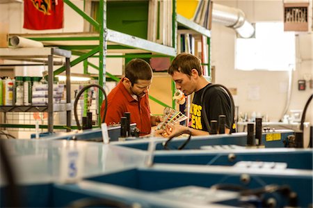 Workers checking color swatches in screen print workshop Stock Photo - Premium Royalty-Free, Code: 614-07031283