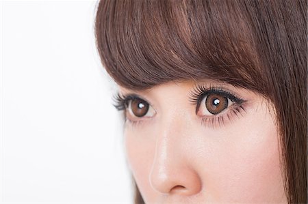 eyes looking away - Portrait of woman with brown eyes, close up Stock Photo - Premium Royalty-Free, Code: 614-07145852
