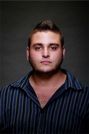 simsearch:649-07560393,k - Studio portrait of young man in striped shirt Photographie de stock - Premium Libres de Droits, Code: 614-07146414