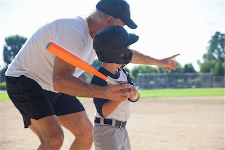 role model (male) - Man teaching grandson to play baseball Stock Photo - Premium Royalty-Free, Code: 614-07146495