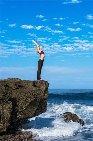 Woman doing yoga at coast Stock Photo - Premium Royalty-Free, Code: 614-07194322