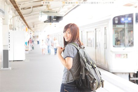 Woman on platform at train station Stock Photo - Premium Royalty-Free, Code: 614-07194462