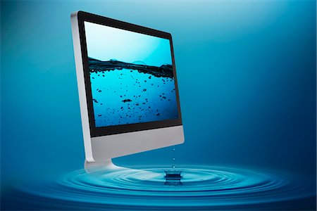 simsearch:614-06813723,k - Still life with computer submerging in water Stock Photo - Premium Royalty-Free, Code: 614-07194715