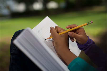simsearch:614-08270379,k - Close up of sisters in park writing in notebook Stock Photo - Premium Royalty-Free, Code: 614-07194737