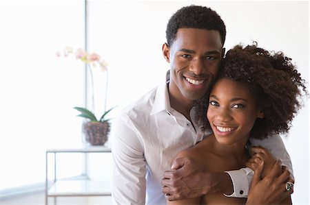 Portrait of young couple, man with arm around woman Stock Photo - Premium Royalty-Free, Code: 614-07194813