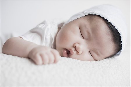 simsearch:614-07031844,k - Close up of baby girl sleeping Stock Photo - Premium Royalty-Free, Code: 614-07234790