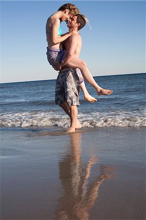 simsearch:614-06896801,k - Couple having fun on beach, Breezy Point, Queens, New York, USA Stock Photo - Premium Royalty-Free, Code: 614-07234830