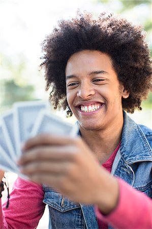 playing cards - Young man playing cards Stock Photo - Premium Royalty-Free, Code: 614-07234903