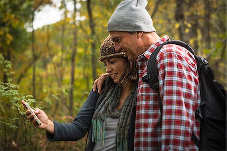 simsearch:614-07239972,k - Mature couple taking self portrait photograph on smartphone in forest Stock Photo - Premium Royalty-Free, Code: 614-07239974