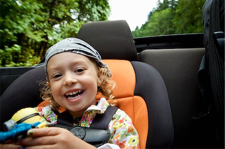 simsearch:614-06625108,k - Portrait of female toddler in back seat of open soft top Foto de stock - Sin royalties Premium, Código: 614-07240002