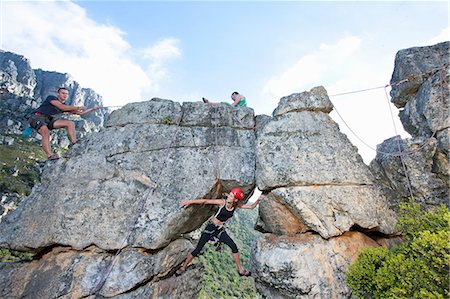 simsearch:6118-09039107,k - Three rock climbers climbing up rock formation Stock Photo - Premium Royalty-Free, Code: 614-07444359