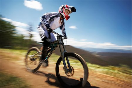 simsearch:614-06624830,k - Female mountain biker speeding down dirt track Stock Photo - Premium Royalty-Free, Code: 614-07444367
