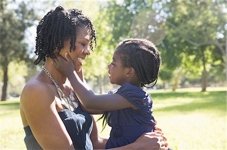 Mature woman carrying affectionate daughter in park Stock Photo - Premium Royalty-Free, Code: 614-07487232