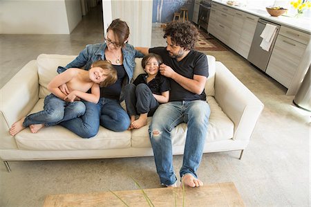 simsearch:614-05650637,k - Family with two boys on sofa Stock Photo - Premium Royalty-Free, Code: 614-07587702