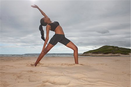 simsearch:614-06168927,k - Young woman practicing yoga position on beach Stock Photo - Premium Royalty-Free, Code: 614-07652235