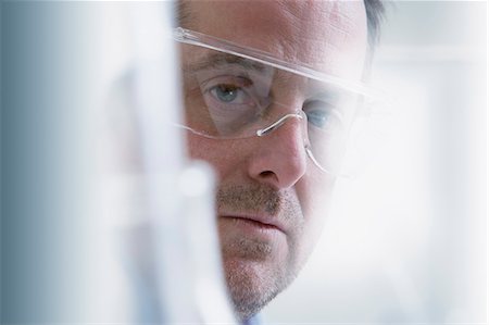 smart man - Scientist wearing protective goggles, close-up Stock Photo - Premium Royalty-Free, Code: 614-07652263