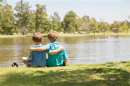 rear view of a boy - Brothers enjoying lakeside, Newport Beach, California, USA Stock Photo - Premium Royalty-Free, Code: 614-07652377