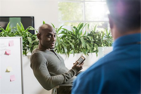 Two male business colleagues meeting in office Stock Photo - Premium Royalty-Free, Code: 614-07708145