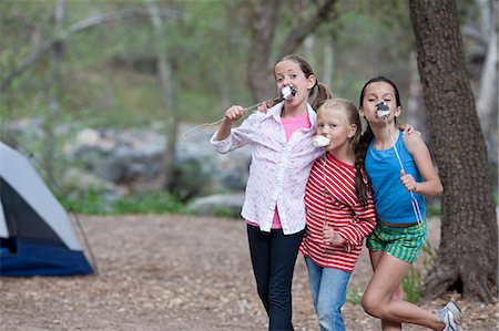 simsearch:614-08270379,k - Portrait of three children eating toasted marshmallows whilst camping, Sedona, Arizona, USA Stock Photo - Premium Royalty-Free, Code: 614-07708328