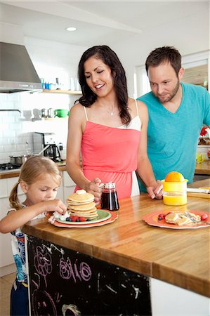 simsearch:614-06896477,k - Mid adult parents watching daughter tempted by pancakes at breakfast bar Stock Photo - Premium Royalty-Free, Code: 614-07735223