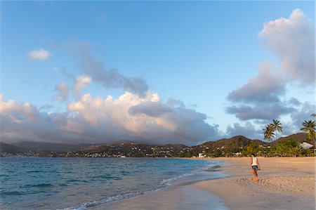 simsearch:614-05557077,k - Rear view of mid adult woman strolling on beach,  Spice Island beach resort, Grenada, Caribbean Stock Photo - Premium Royalty-Free, Code: 614-07735304