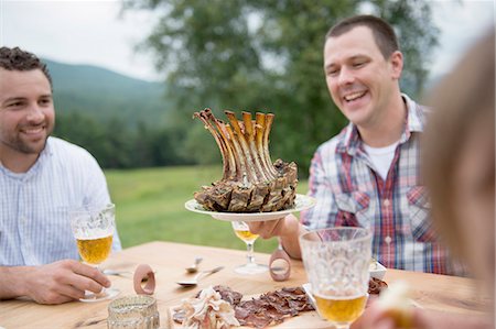 Small group of adults enjoying meal, outdoors Stock Photo - Premium Royalty-Free, Code: 614-07806366