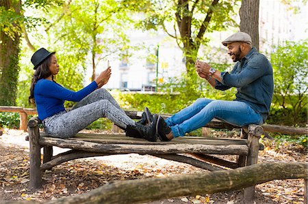 simsearch:614-08119553,k - Couple taking photograph on bench, Central Park, New York, USA Stock Photo - Premium Royalty-Free, Code: 614-07911869