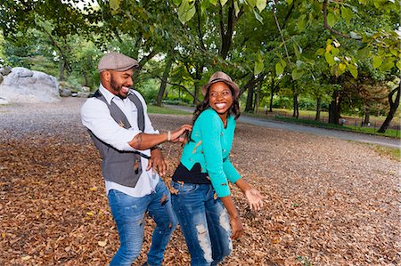simsearch:614-08119553,k - Couple playing with autumn leaves Stock Photo - Premium Royalty-Free, Code: 614-07911884