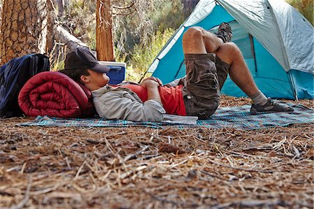 simsearch:6109-06003893,k - Young male camper resting in forest, Los Angeles, California, USA Stock Photo - Premium Royalty-Free, Code: 614-08000201