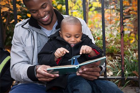 simsearch:649-07064267,k - Male toddler and father reading storybook in park Stock Photo - Premium Royalty-Free, Code: 614-08030497