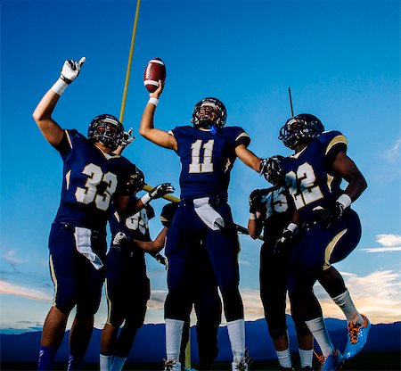 football team - Teenage and young male american football team celebrating Stock Photo - Premium Royalty-Free, Code: 614-08030969