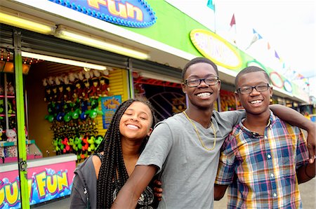 simsearch:614-08270379,k - Portrait of teenage boys and sister at amusement park Stock Photo - Premium Royalty-Free, Code: 614-08031078