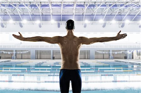 swimming men athletes - Male swimmer with arms out, rear view Stock Photo - Premium Royalty-Free, Code: 614-08031113