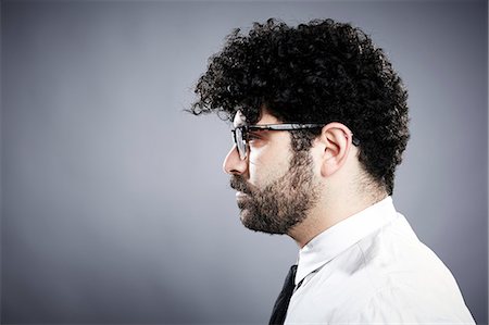 profile - Profile of young man with black curly hair Stock Photo - Premium Royalty-Free, Code: 614-08066089