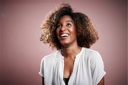 excited african american person - Portrait of young woman, looking away, laughing Stock Photo - Premium Royalty-Free, Code: 614-08066083