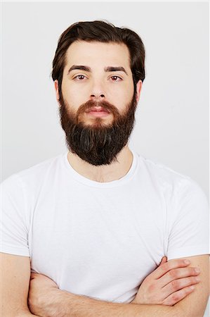 Portrait of bearded man in white t-shirt Stock Photo - Premium Royalty-Free, Code: 614-08066099