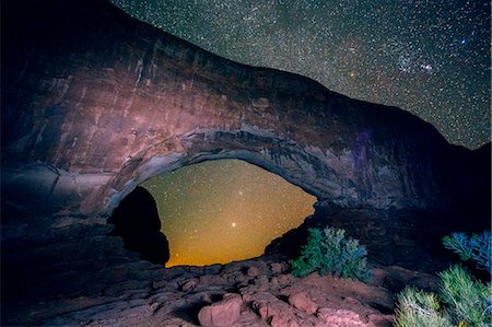 Arched rock formation and starry night sky, Arches National Park, Moab, Utah, USA Stock Photo - Premium Royalty-Free, Code: 614-08081232