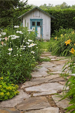 shed (small structure) - Stone paving leading to garden shed Stock Photo - Premium Royalty-Free, Code: 614-08119714