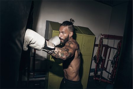 simsearch:614-00657246,k - Male boxer punching gym punch bag Stock Photo - Premium Royalty-Free, Code: 614-08119883