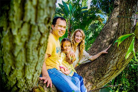 simsearch:614-06896477,k - Portrait of mature couple and daughter sitting on garden tree branch Stock Photo - Premium Royalty-Free, Code: 614-08126680