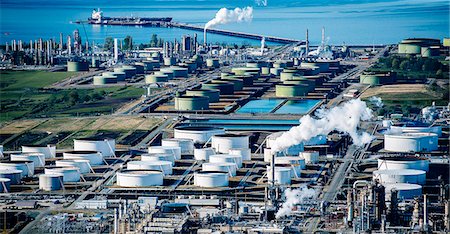 High angle view of white oil storage tanks in coastal oil refinery Stock Photo - Premium Royalty-Free, Code: 614-08120014