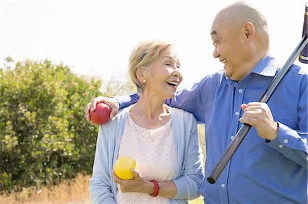 fitness asian couple - Portrait of senior couple in park, holding croquet mallet and balls Stock Photo - Premium Royalty-Free, Code: 614-08220047