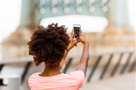 simsearch:614-03982063,k - Back view of young woman taking selfie Photographie de stock - Premium Libres de Droits, Code: 614-08270431