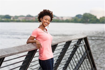 Young woman with afro hair Stock Photo - Premium Royalty-Free, Code: 614-08270432