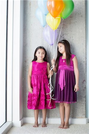 simsearch:614-07768068,k - Portrait two young girls holding balloons Stock Photo - Premium Royalty-Free, Code: 614-08329253