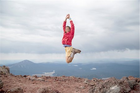 Young woman jumping for joy at the summit of South Sister volcano, Bend, Oregon, USA Stock Photo - Premium Royalty-Free, Code: 614-08329263