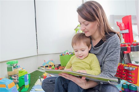 simsearch:649-07436413,k - Mother reading to son at home Stock Photo - Premium Royalty-Free, Code: 614-08392333