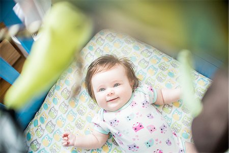 simsearch:649-07521015,k - Overhead view of baby girl lying in crib smiling Stock Photo - Premium Royalty-Free, Code: 614-08392727